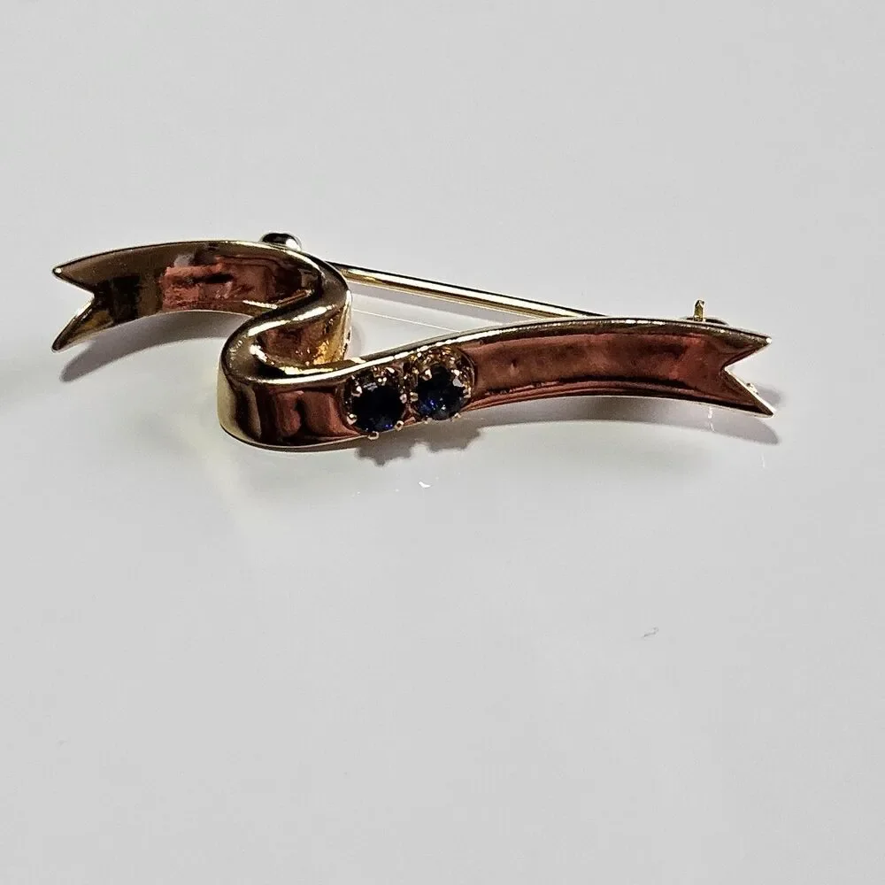 Avon Gold Tone Blue Stone Ribbon Pin Signed 1985